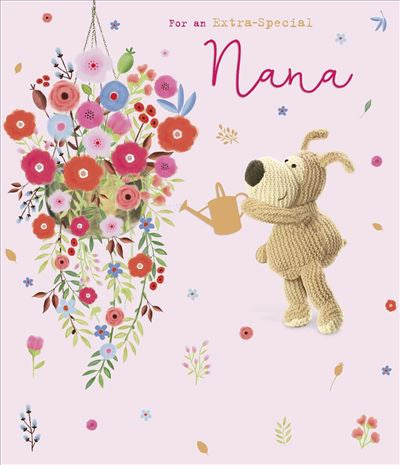 A knitted dog with a watering can gazes at a colorful hanging bouquet under For an Extra-Special Nana. The light pink background, decorated with small flowers and leaves, makes it perfect for sending birthday love. Product: Birthday Nana Cute by UK Greetings.